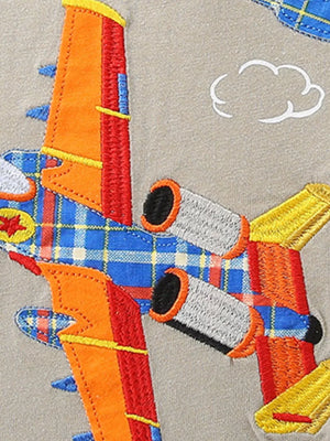 Toddler t-shirt with embroidered airplane applique featuring plaid wings and orange accents.