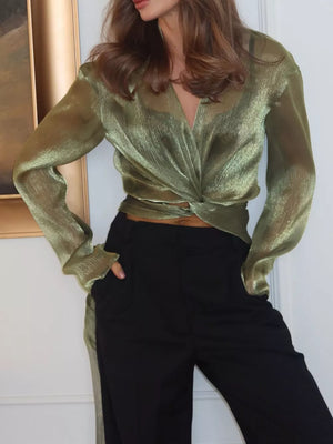 100% polyester Care instructions: Machine wash cold wrap top in metallic olive green with relaxed silhouette