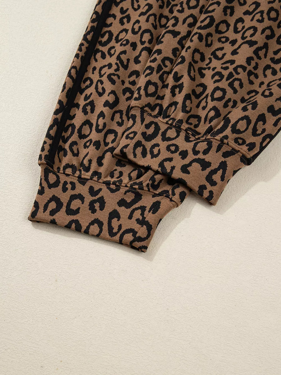 Leopard print joggers with drawstring detail and cuffed hem.