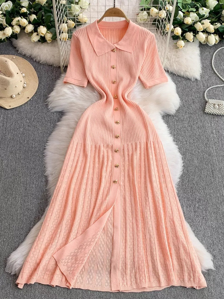 Light pink ribbed knit midi dress with button detail, collared neckline and short sleeves.