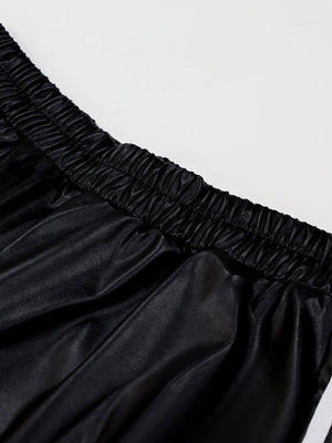 Black faux leather wide leg track pants with elastic waistband detail