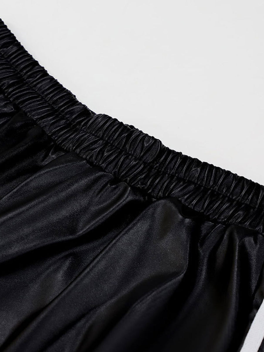 Black faux leather wide leg track pants with elastic waistband detail