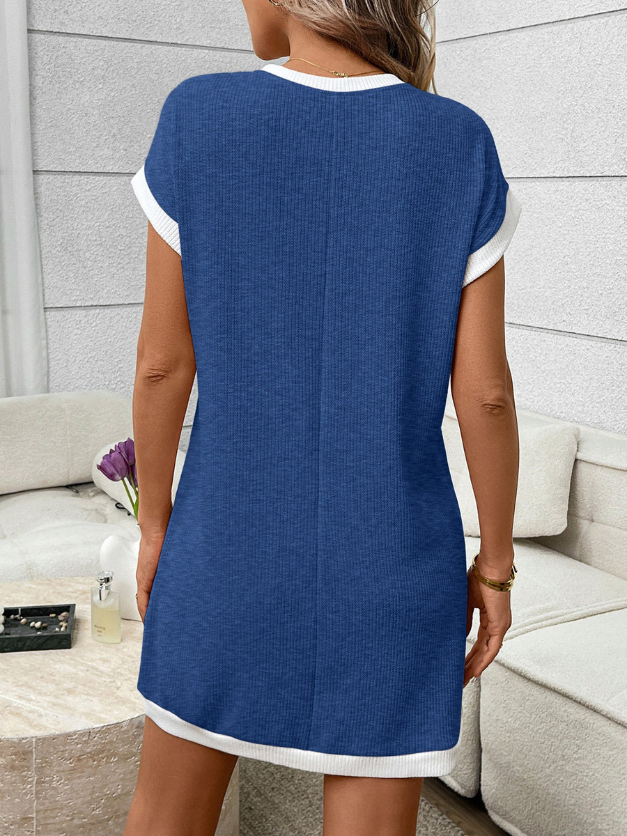 Ribbed knit mini dress in dark blue with white trim, short sleeves, and crew neck.