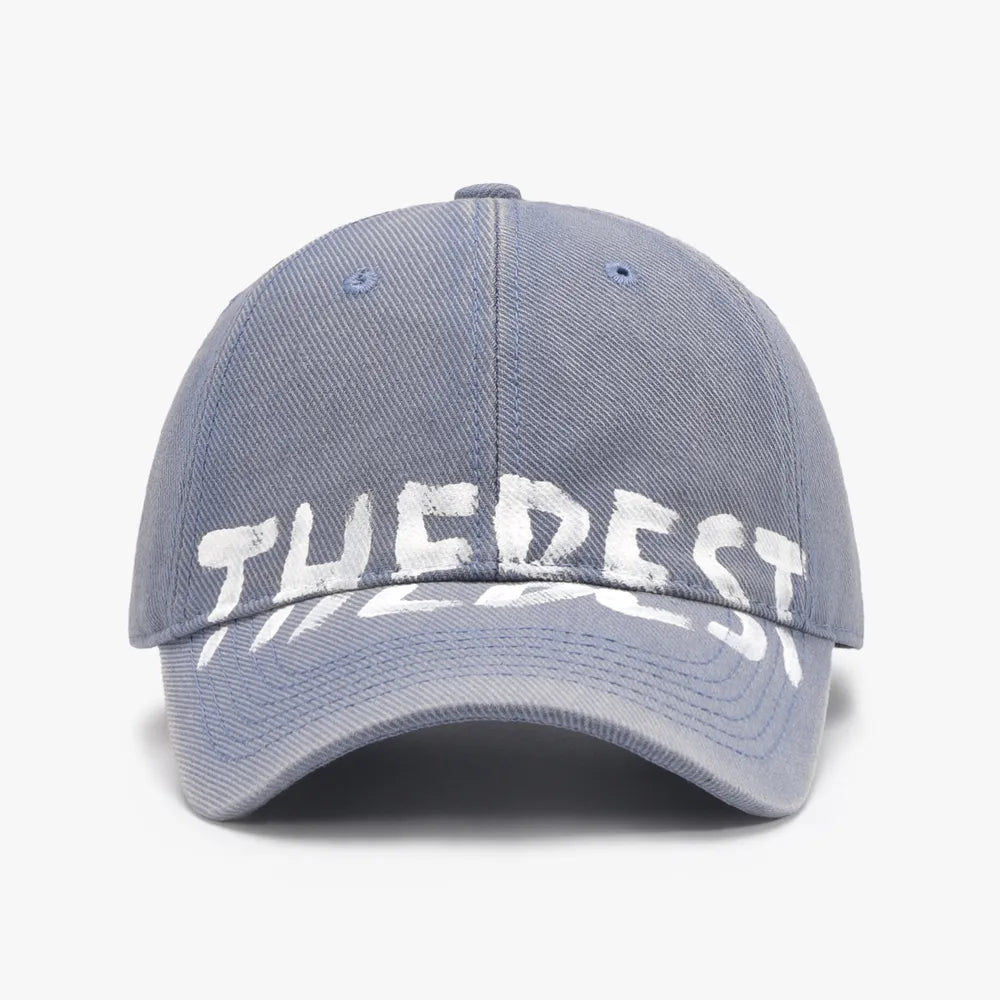 Dusty Blue textured denim baseball cap with white graphic text.