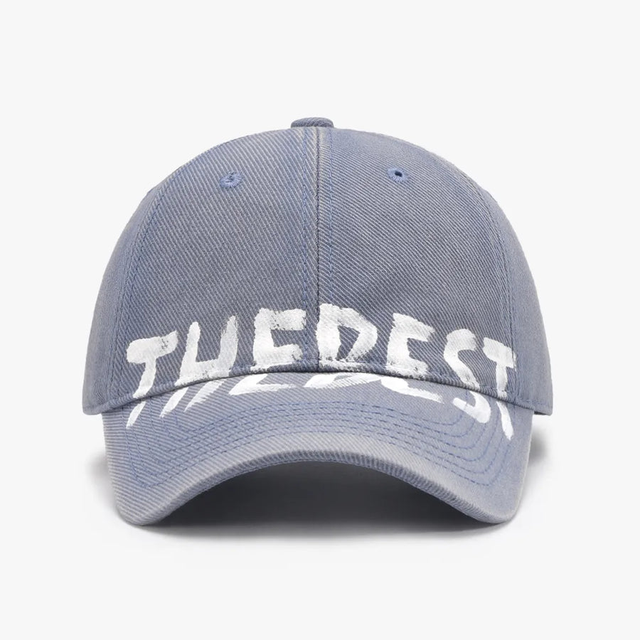 Dusty Blue textured denim baseball cap with white graphic text.