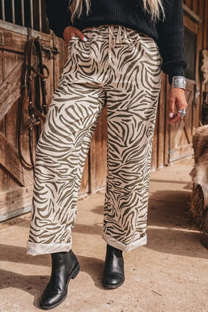 wide-leg pants in ivory featuring drawstring and relaxed fit
