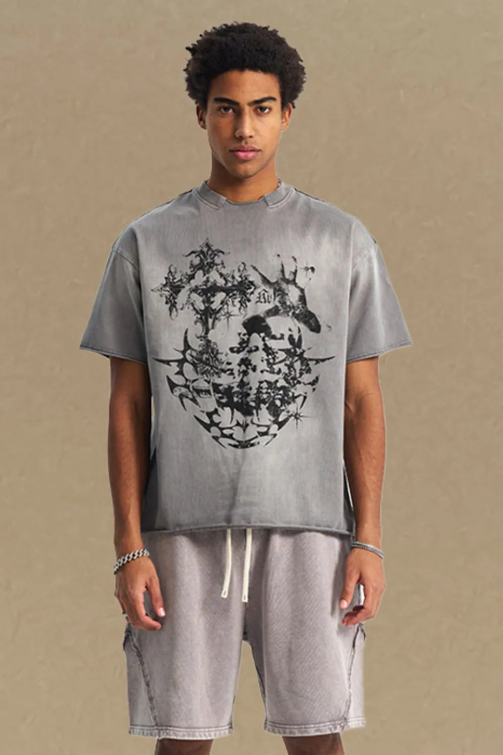 Gray distressed graphic tee with raw hem and crew neck.