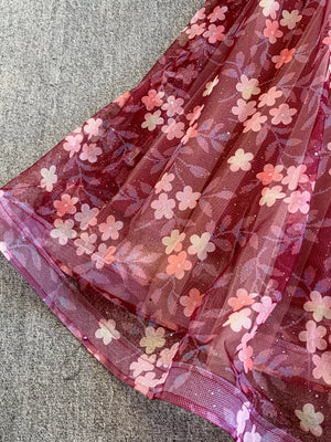 Crimson tulle maxi dress with a floral print and subtle glitter detail.