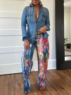 Abstract print high-waisted wide-leg pants in cotton blend, featuring a colorful artistic design.
