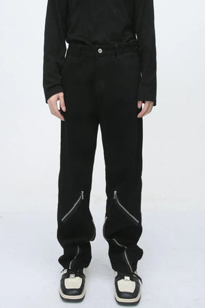 Black straight leg jeans with zip detail at the ankle