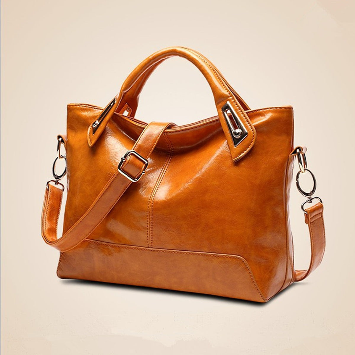 tote in camel featuring adjustable strap and boxy fit