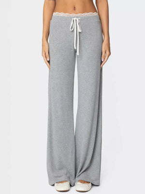 Grey wide leg lounge pants with lace trim waistband and drawstring.