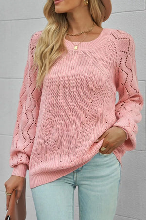 Dusty pink knit sweater with hollow-out puffy sleeves and diamond pattern detail.