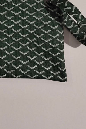 Plaid print wristlet clutch bag in army green with white geometric pattern and grommet detail.