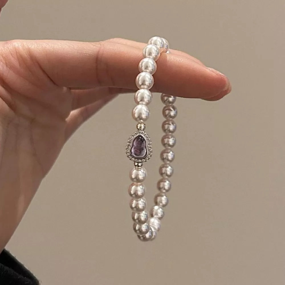 bracelet in ivory featuring pearls and regular fit