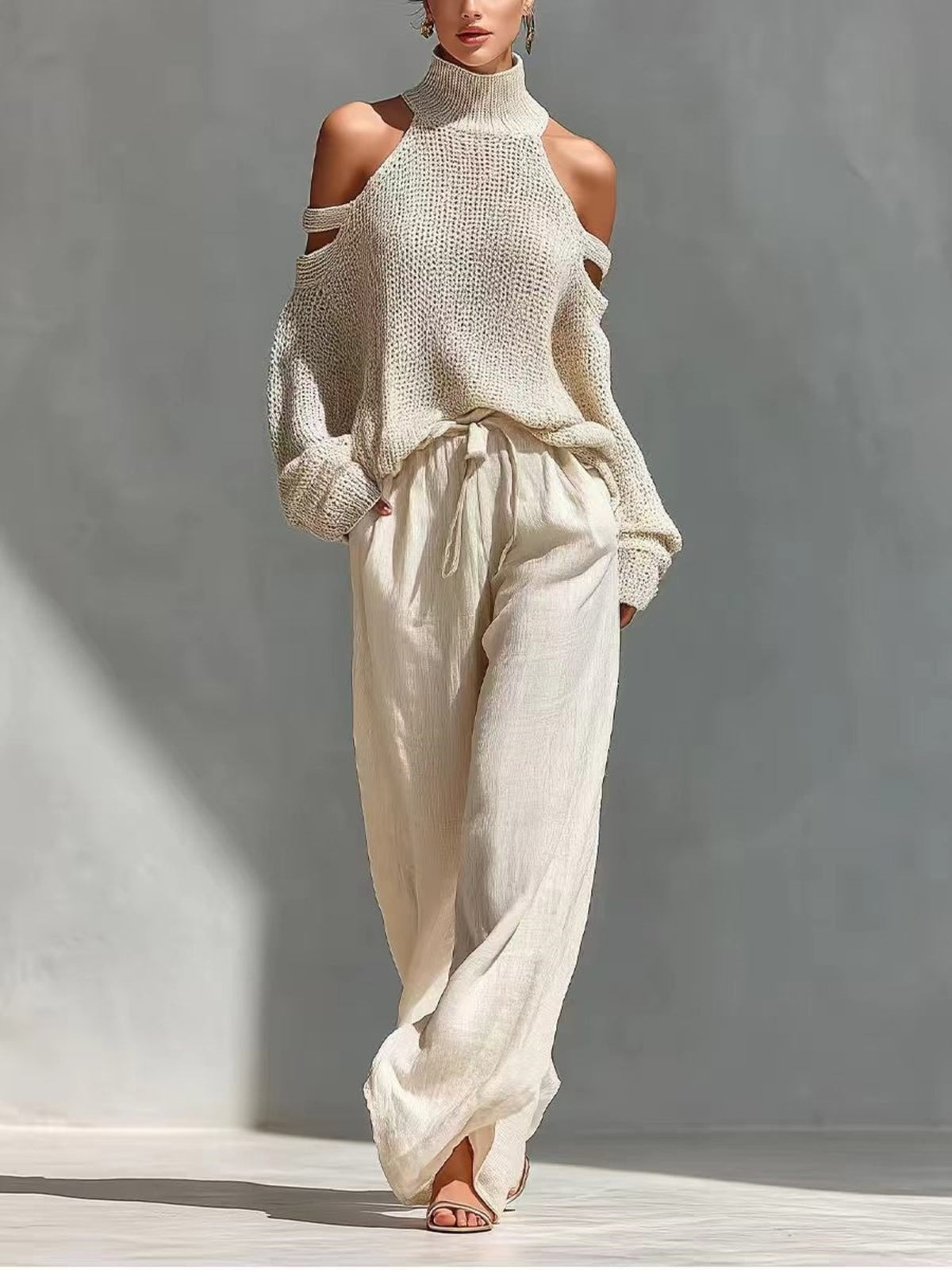 pullover sweater in cream featuring drawstring and relaxed fit