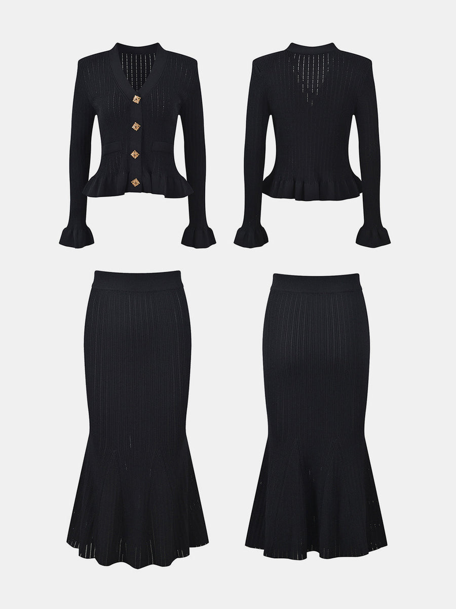 Black knit cardigan with ruffled hem and gold buttons, paired with a matching ribbed midi skirt.