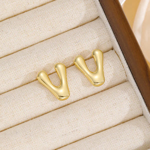 Alphabetical sculpted stud earrings in gold, Style V, with a bubble design.