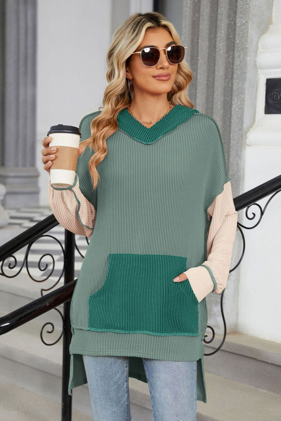 Green ribbed v-neck hoodie with colorblock sleeves and a front pocket