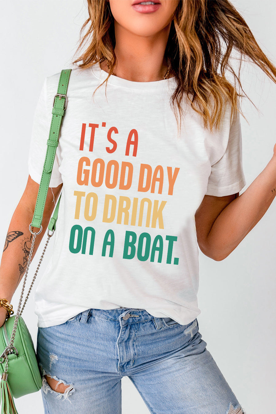 White graphic t-shirt with colorful text that says It's a Good Day to Drink on a Boat.