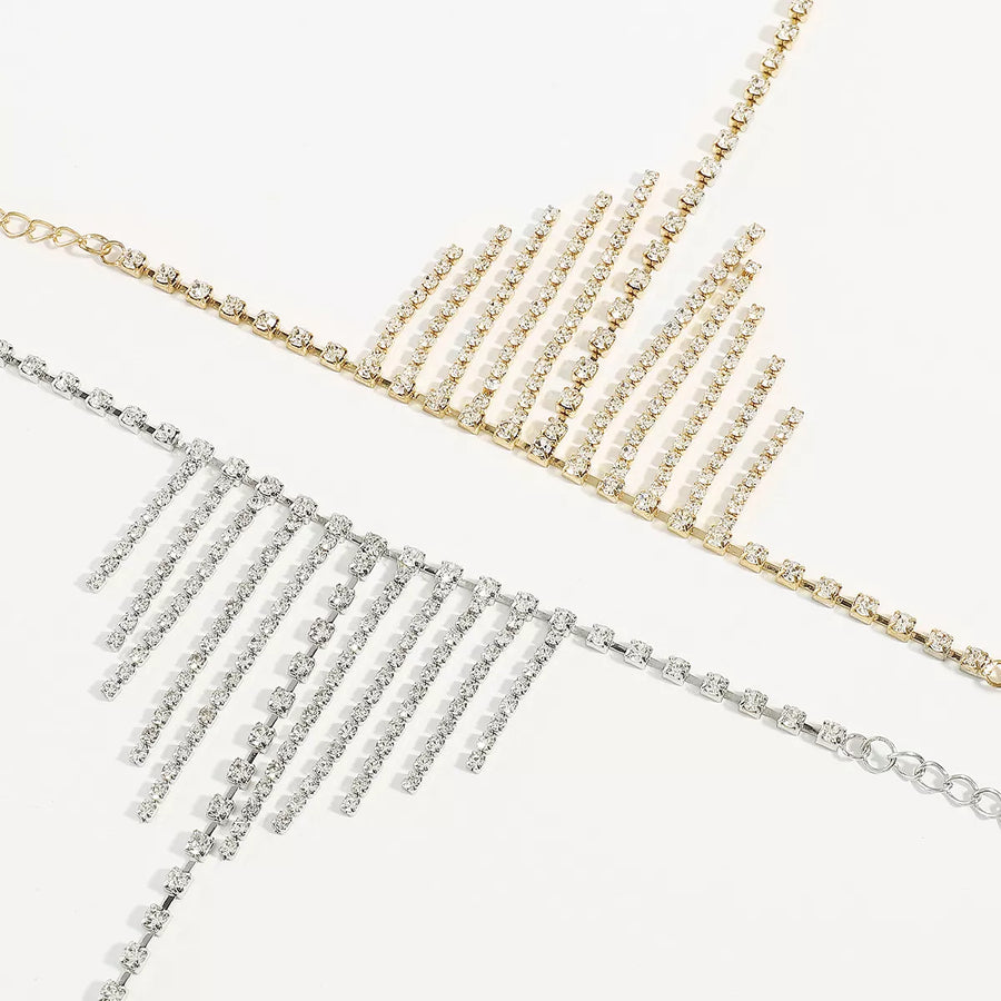 Rhinestone fringe hand chain bracelet in gold and white k, 18K gold-plated with dangling chains.
