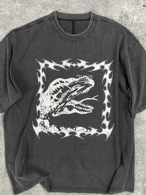 Black distressed graphic tee with white dinosaur motif and tribal border.