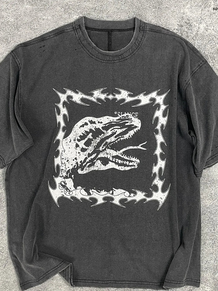 Black distressed graphic tee with white dinosaur motif and tribal border.