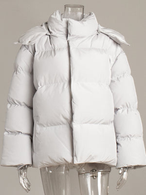 Light grey puffer jacket with a high neck and hood